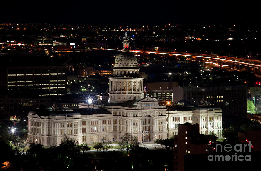 Austin Photograph - The Texas State Capitol at night as rush hour traffic lights str by Dan Herron