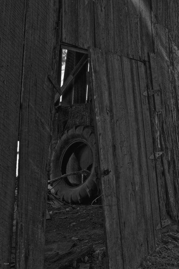 The Tire The Doorway And The Hanger Photograph by Jason Blalock