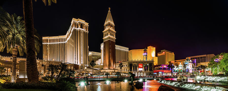 The Venetian Casino in Front of the Mirage Lagoon at Night Photograph by Aloha Art