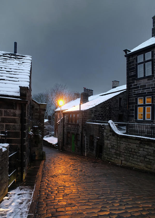 The Village Of Heptonstall In The Snow At Night With Lamps Shini Photograph by Philip Openshaw