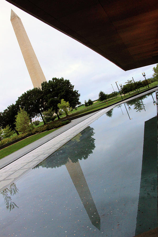 The Washington Monument At An Angle From The Awning And Pond Of The National African American Museum Photograph by Cora Wandel
