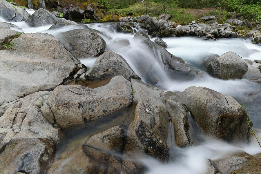 The way water forms rocks Photograph by Jeff Swan