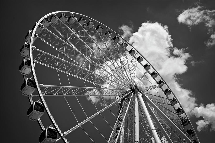 The Wheel And Sky In Black and White Photograph by Greg and Chrystal Mimbs