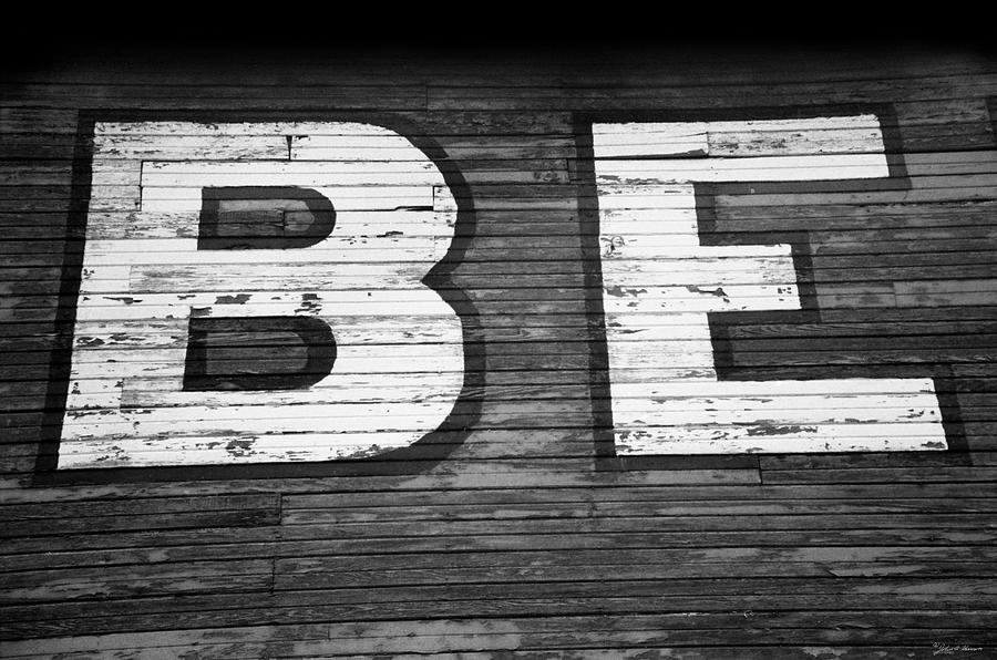 The word Be painted on the side of old building Photograph by John Harmon