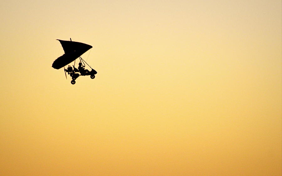 Sunset Photograph - Those Magnificent Men in Their Flying Machines by AJ  Schibig