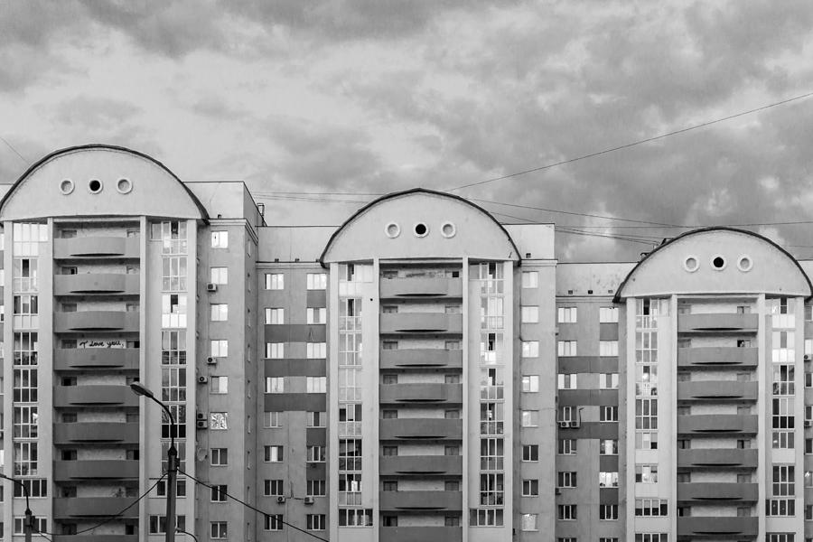 Three Apartment Buildings and Cloudy Sky Photograph by John Williams