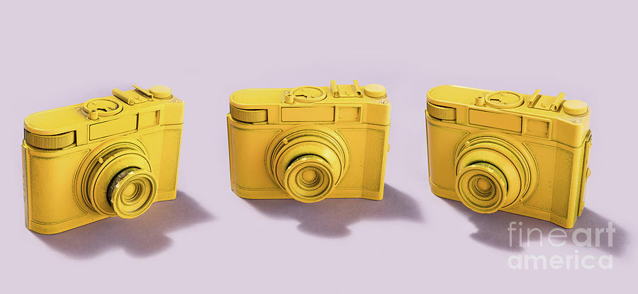 Three cameras standing on pink background Photograph by Michal Bednarek