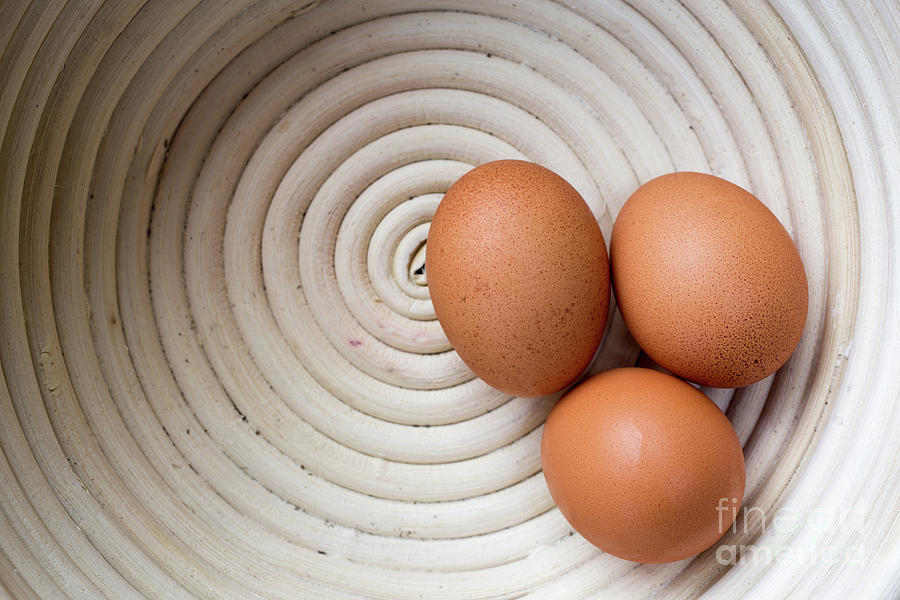 Three Country Eggs in a white bowl Photograph by Edward Fielding