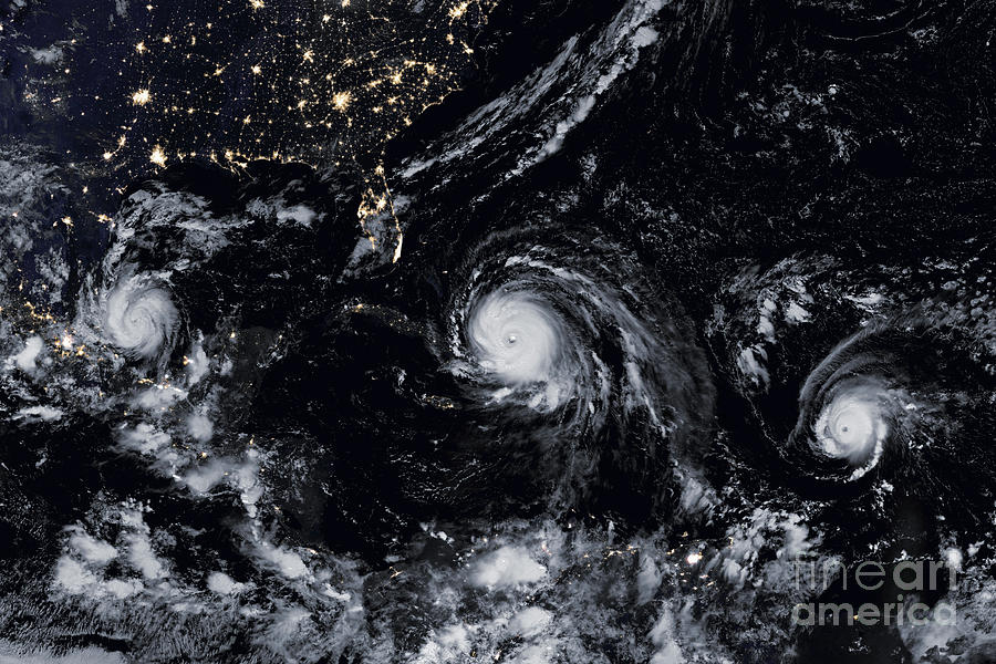 Three Hurricanes at Night Photograph by Jon Neidert