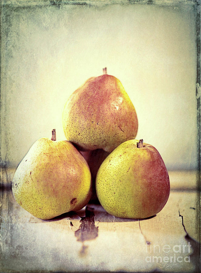 Three Pears Stacked Photograph by Linda Olsen