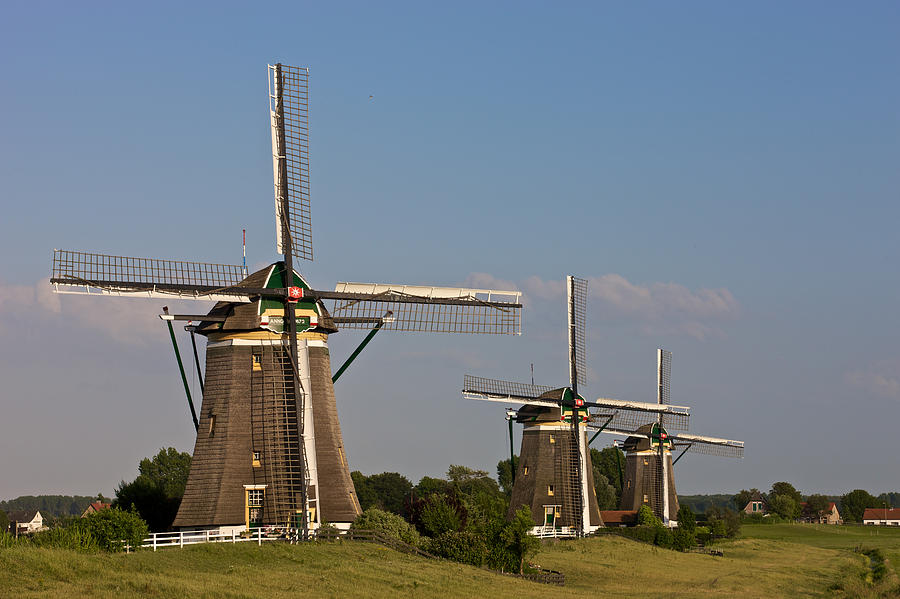Three windmills Photograph by Johan Elzenga