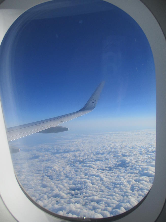 Airplane Photograph - Through the window of an airplane by Anamarija Marinovic