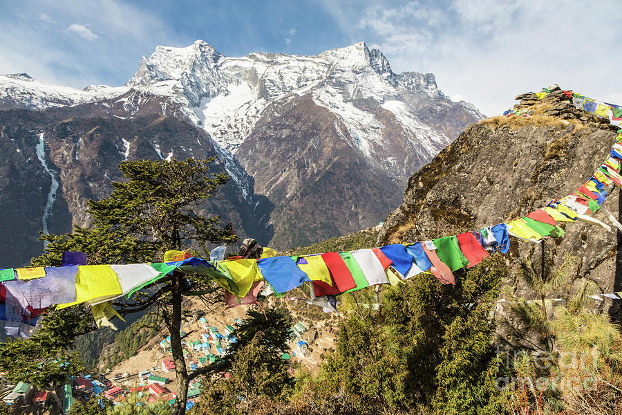 Tibetan Buddhism prayer flags on the top of Namche bazaar Photograph by Didier Marti