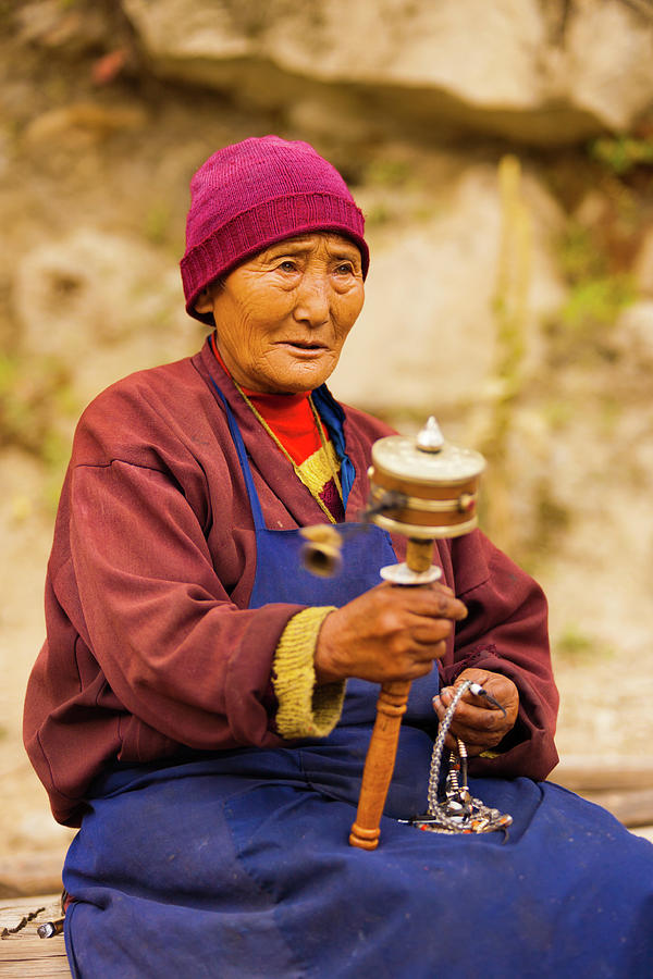 Tibetan Woman Pilgrim Praying Spinning Mani Wheel Photograph by Pius ...