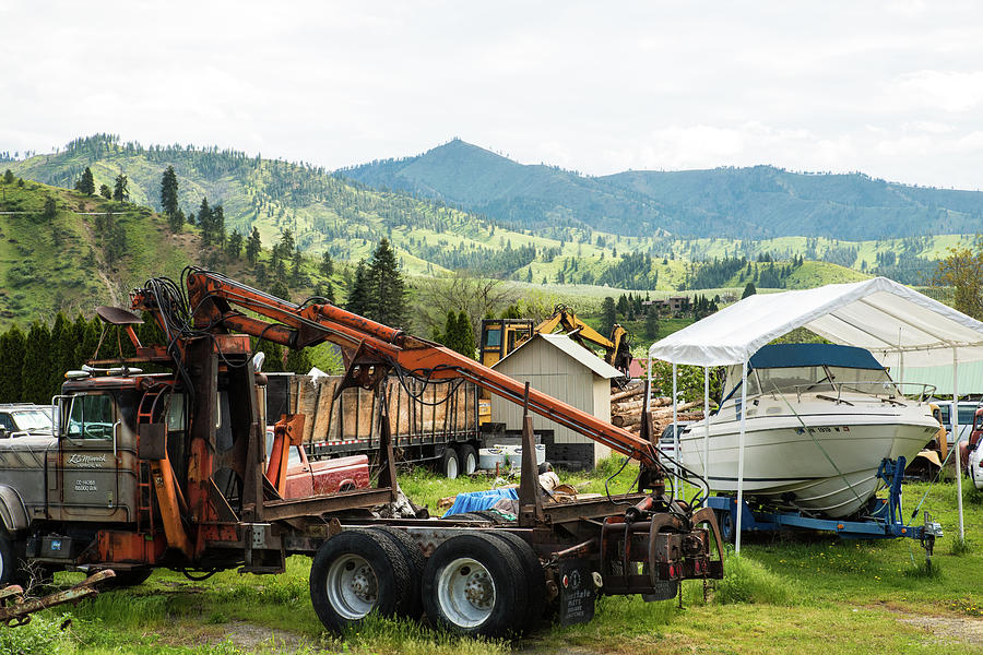 Timber Harvester and Covered Boat Photograph by Tom Cochran