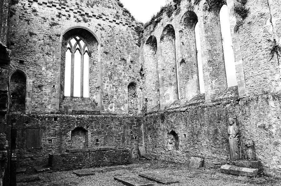 Tipperary Ireland Athassel Priory Medieval Ruins Lancet Windows and St Joseph Statue Black and White Photograph by Shawn OBrien