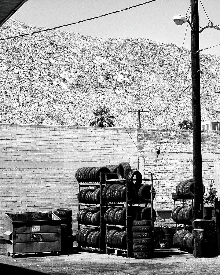 IN THE LINE OF TIRES Palm Springs CA Photograph by William Dey
