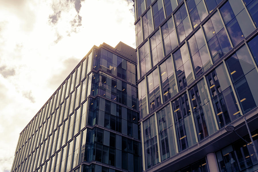 Top of Glass Buildings with Clouds Split Toning Photograph by Jacek ...