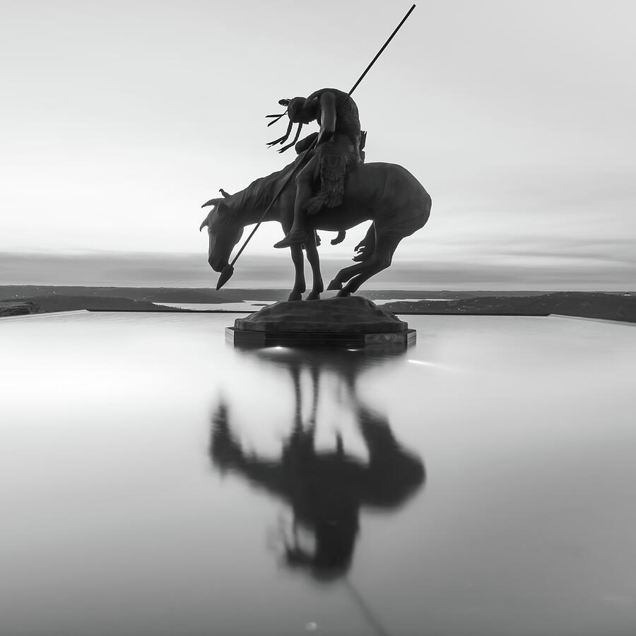 Black And White Photograph - Top of the Rock Native American Statue Silhouette Reflections BW by Gregory Ballos