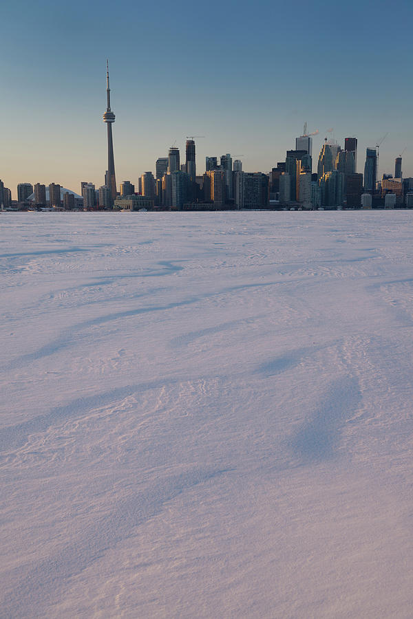 Toronto city skyline in winter from snow covered Lake Ontario at ...