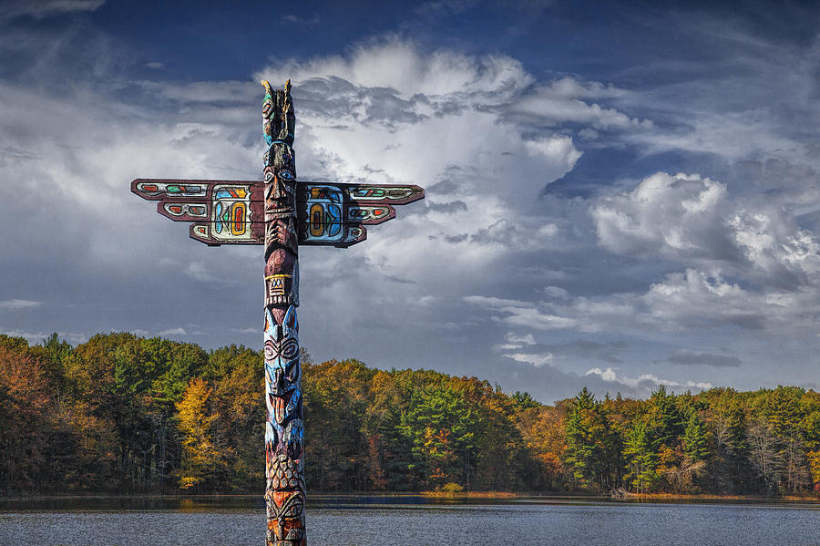 Totem Pole during Autumn by a Lake Photograph by Randall Nyhof