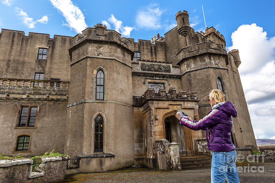 Tourist visits Dunvegan Castle Photograph by Benny Marty