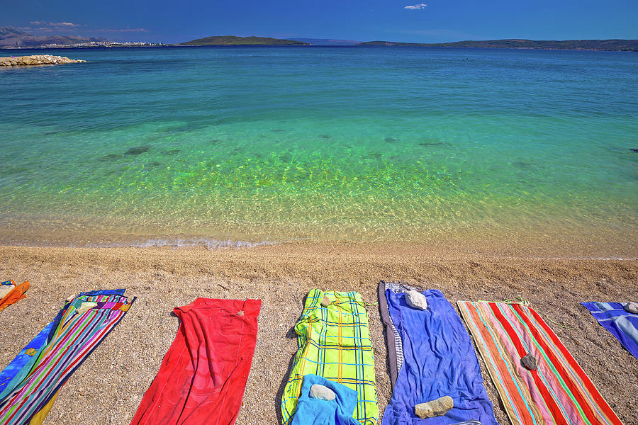 Towels on idyllic beach in Kastela bay Photograph by Brch Photography