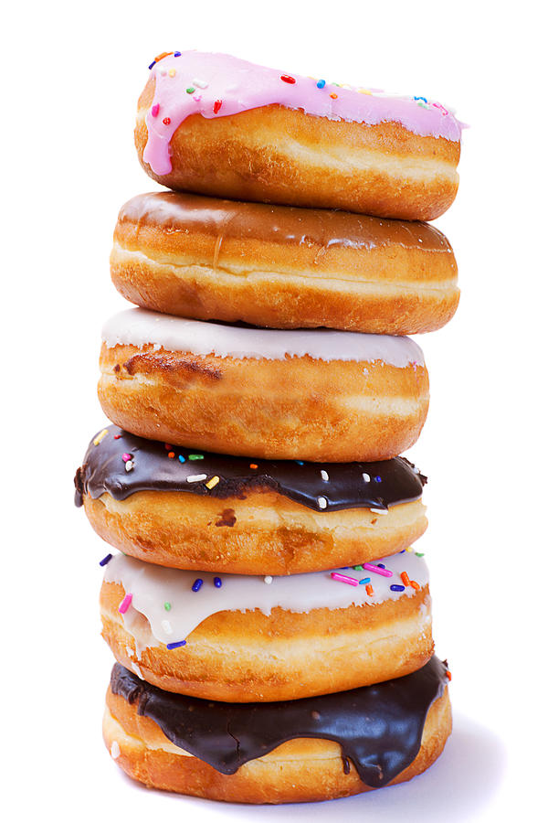 Donut Photograph - Tower of Freshly Baked Donuts with Icing by Donald  Erickson
