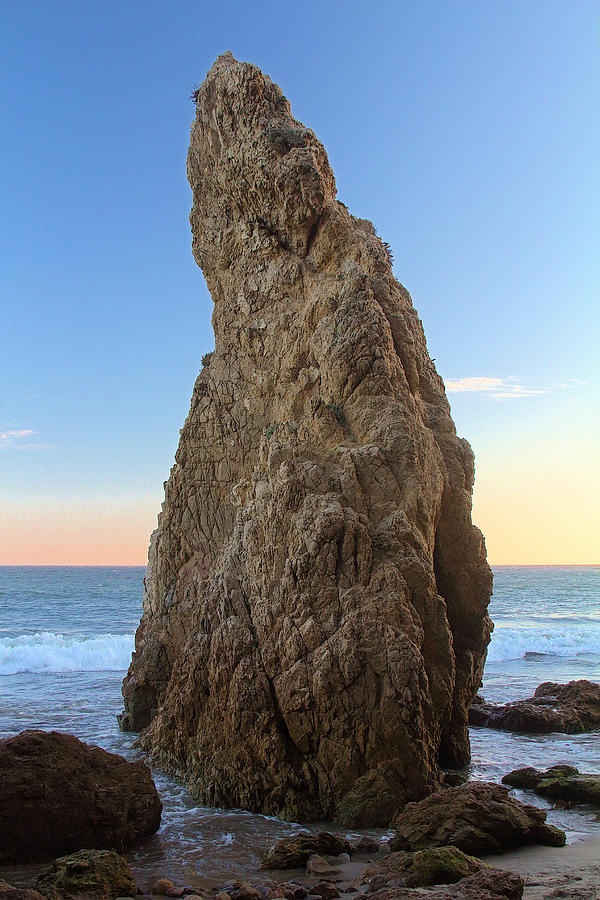 Towering boulder from el matador beach Photograph by Viktor Savchenko