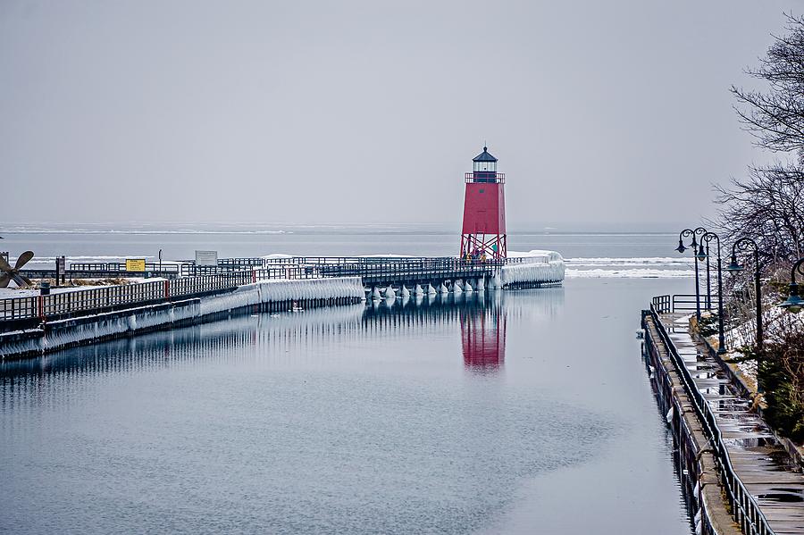 town of Charlevoix and South Pier Lighthouse on lake michigan Photograph by Alex Grichenko