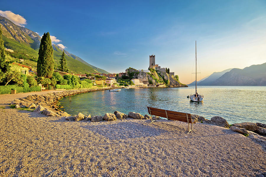 Town of Malcesine castle and beach view Photograph by Brch Photography