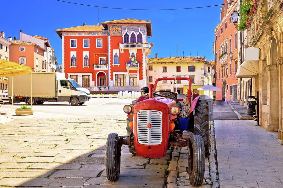 Town of Vodnjan colorful square and old tractor view Photograph by Brch Photography