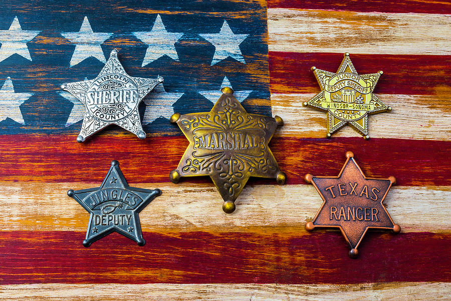 Toy Badges On America Flag Photograph by Garry Gay