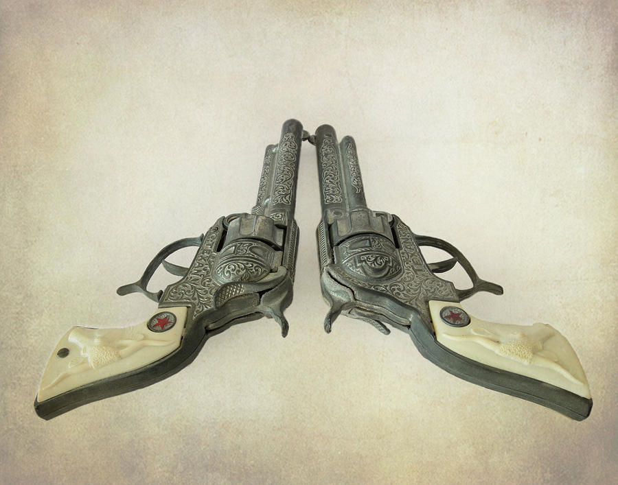 Toy Western Cap Pistols Photograph by David and Carol Kelly
