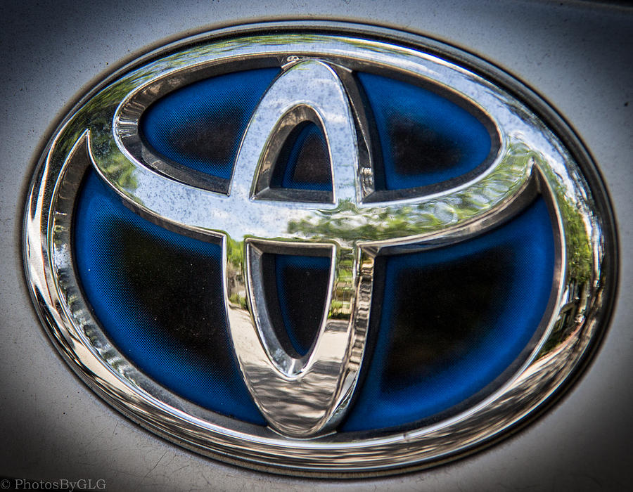 Car Photograph - Toyota Emblem by Gregory Gendusa