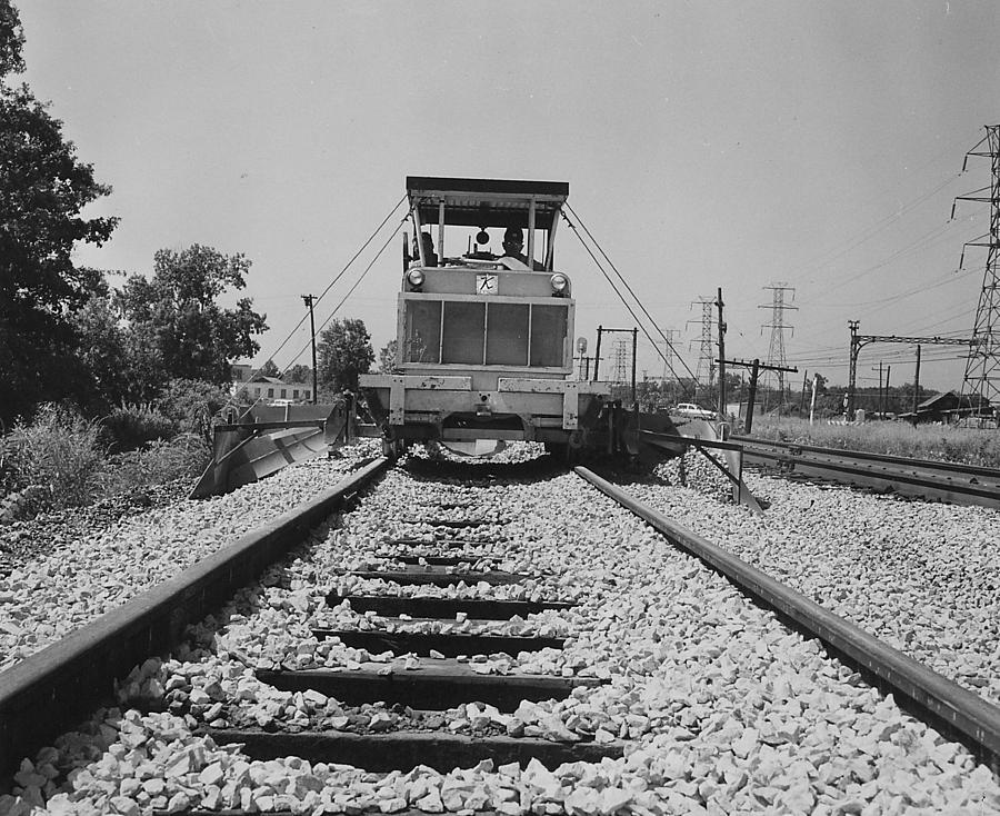 Track Machine Working on Rail - 1957 Photograph by Chicago and North Western Historical Society
