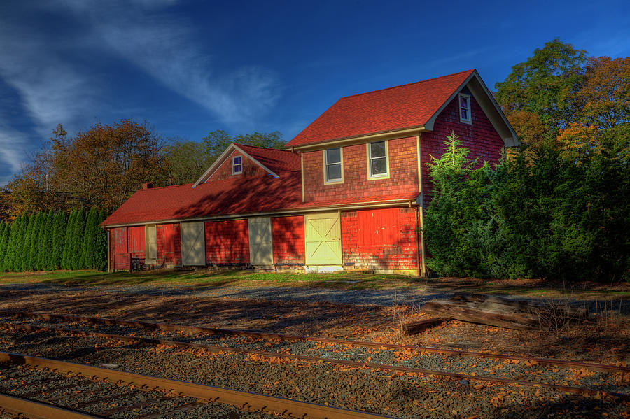 Tracks and red barn Photograph by Steve Gravano