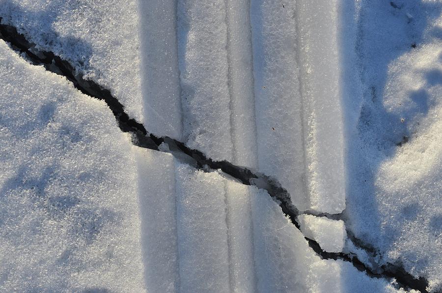 Tracks In The Snow And A Crack In The Ice  Digital Art by Lyle Crump