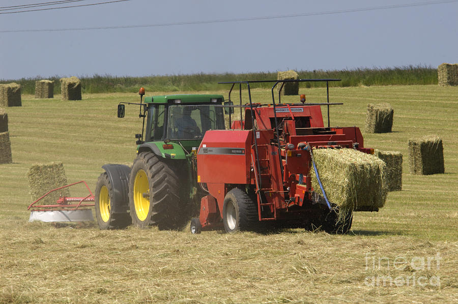 Summer Photograph - Tractor bailing hay at harvest time by Andy Smy