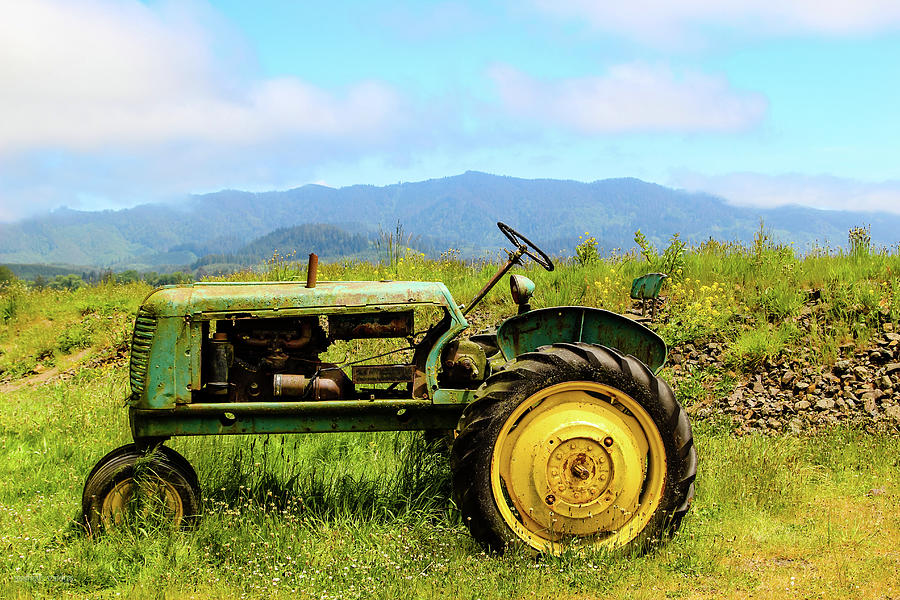 Tractor on a pasture Photograph by Aashish Vaidya