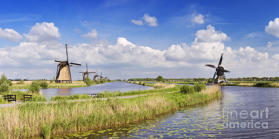 Spring Photograph - Traditional Dutch windmills on a sunny day at the Kinderdijk by Sara Winter