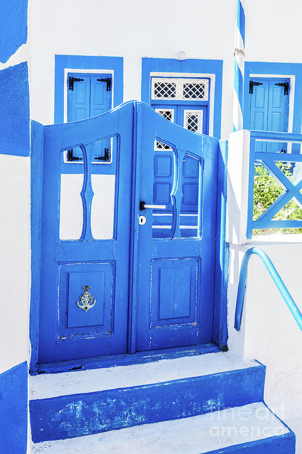 Traditional Greek stone house, blue gate and window shutters, Santorini island, Greece Photograph by Michal Bednarek