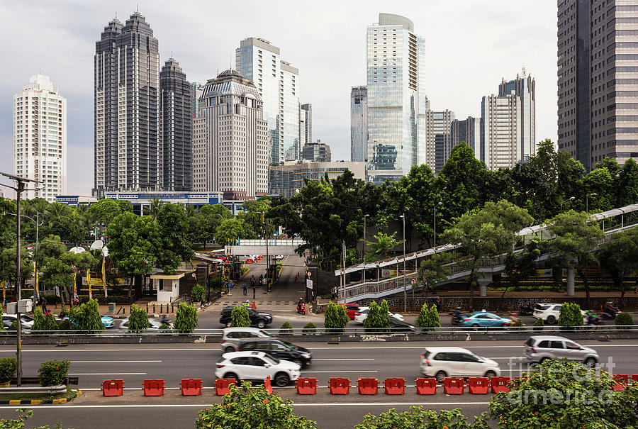 Traffic on highway in Jakarta business district in Indonesia cap Photograph by Didier Marti