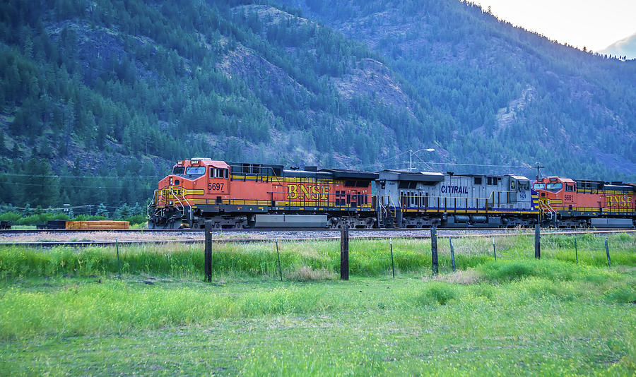 Train Moving Through Flathead Reservation In Montana Mountains Photograph by Alex Grichenko