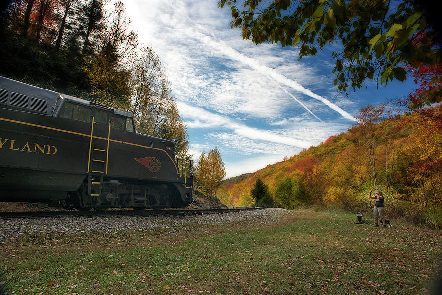 Train on the tracks in the mountains during Fall season Photograph by Dan Friend