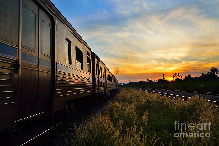 Train Passing by over Rural Railway in the Morning or at Dawn wi