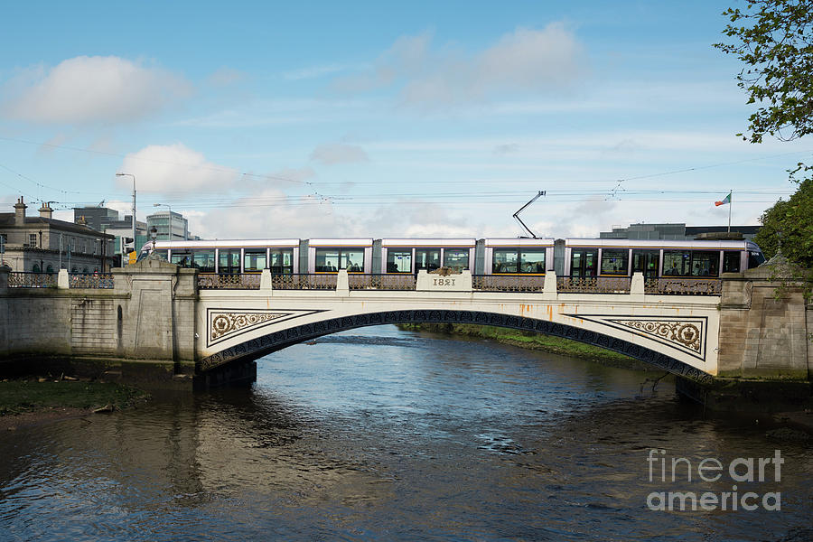 Tram on the Sean Heuston Bridge Photograph by Andrew Michael