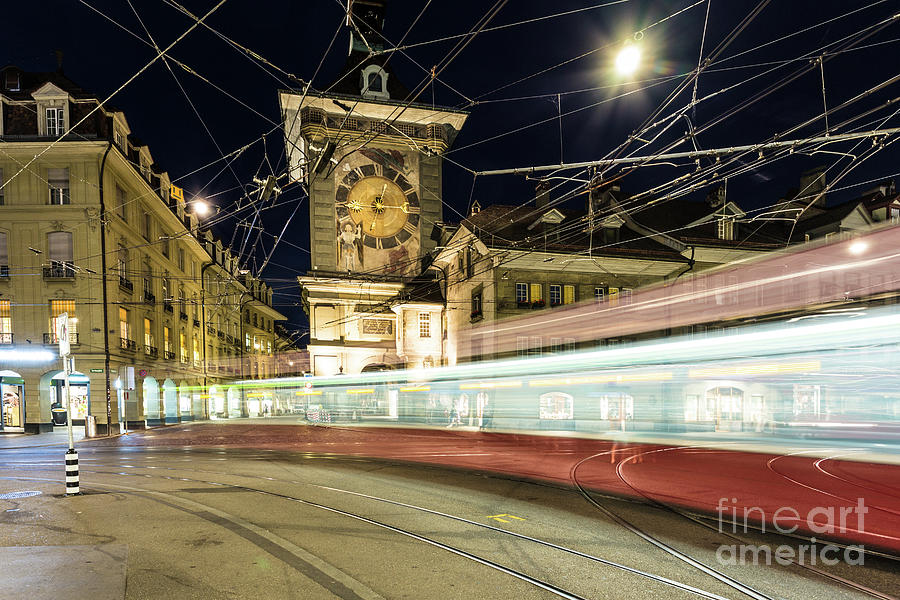 Tram rushes at night in Bern, Switzerland capital city Photograph by Didier Marti