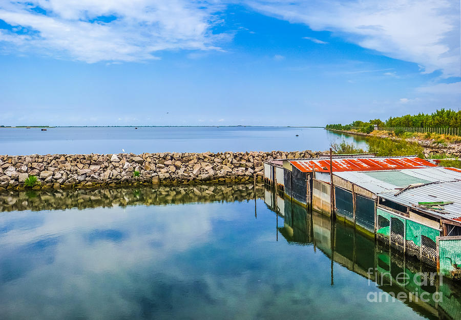 Tranquil seascape with shanties Photograph by JR Photography