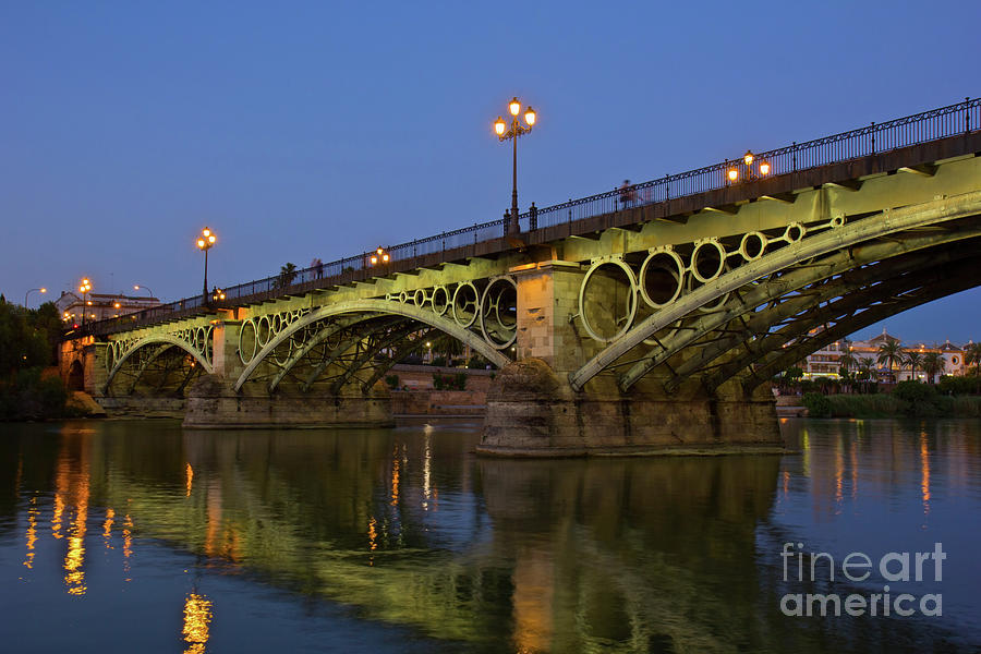 Triana Bridge of Seville at Night Photograph by Anastasy Yarmolovich